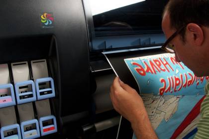 HP Designjet Z6200 42in Photo Printer Man inspecting print